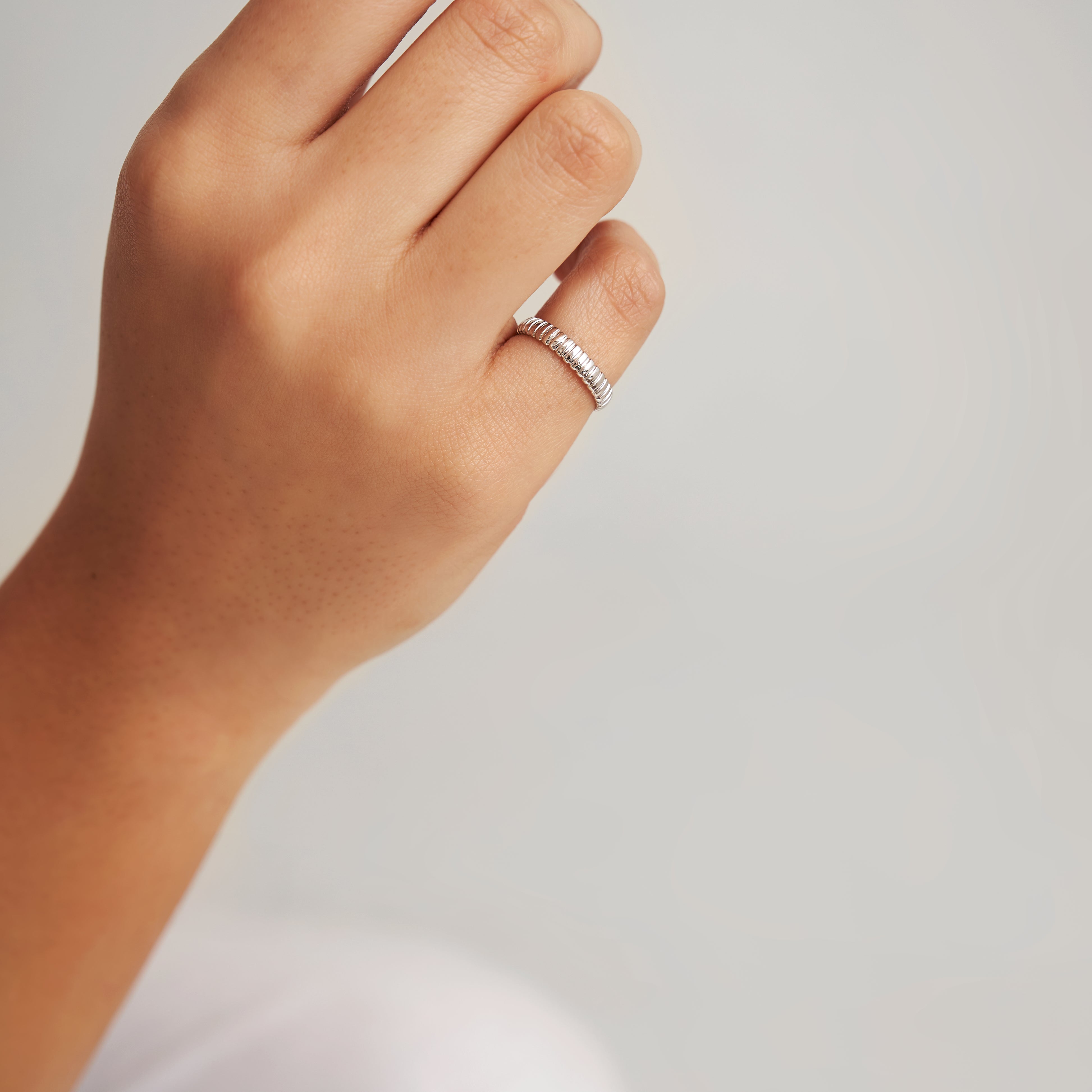 Tubogas ring with coiled design