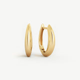 14k yellow gold tapered hoop earrings with a bold, sleek silhouette, displayed on a white background.