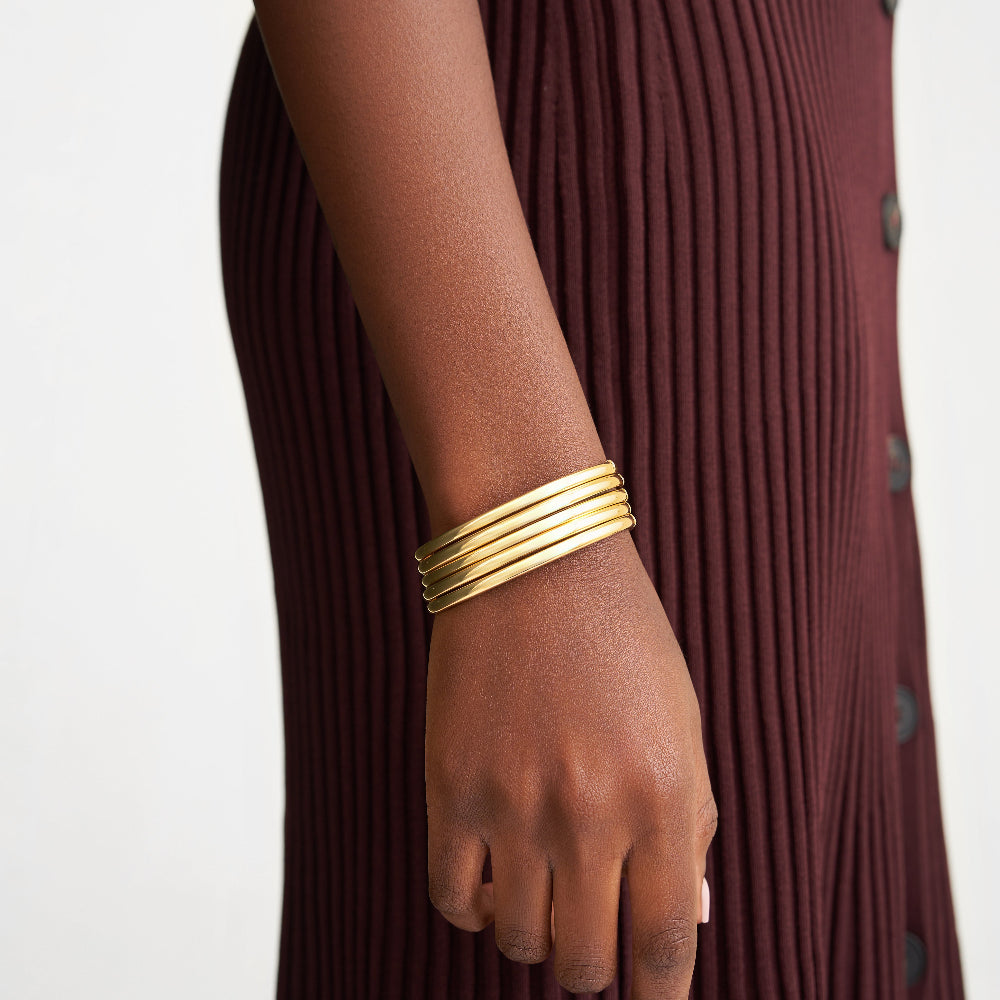 stacked 14k gold bangles