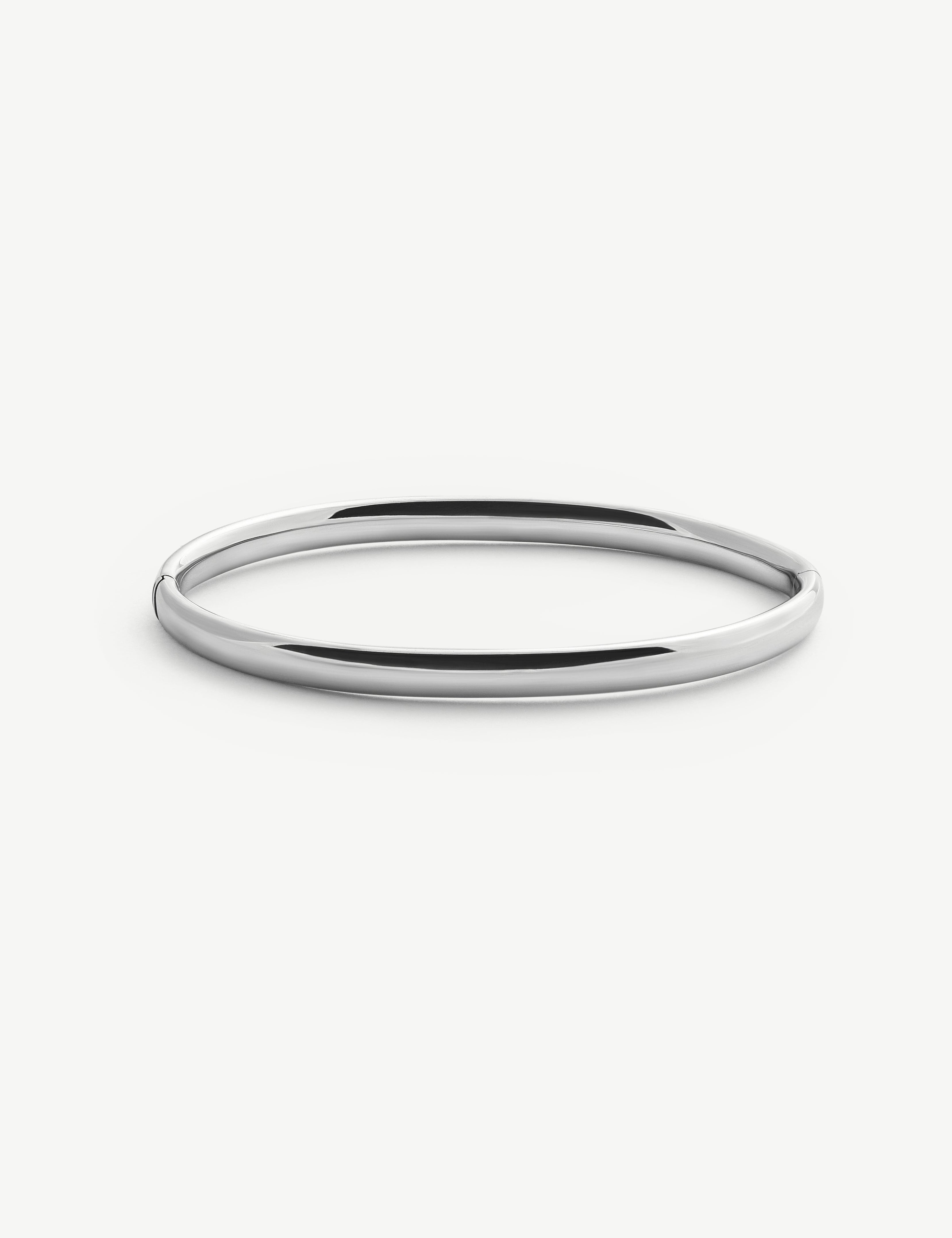 Silver bangle on a white background